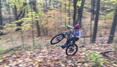 Climbing one of the many hills while making the front tire light!!!