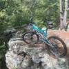 Every time I ride this trail I stop to enjoy the view on this limestone rocks. The trail winds around and passes under this.