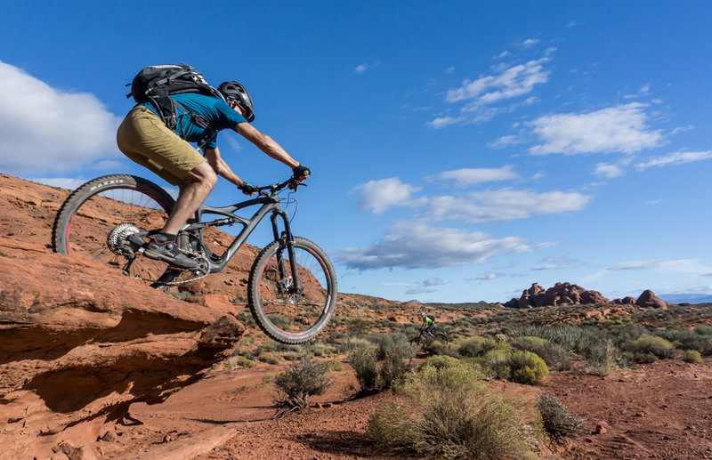 Catching a little air off one of the small drops on Church Rocks!