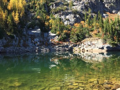 Fuse Lake shoreline with larch in fall colors.