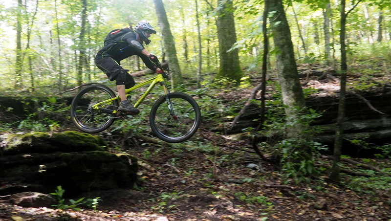 Small rock drop near the Bluffs SE of Lake Ann.  Get some speed up, because there's a rock on the landing to wreck rims!