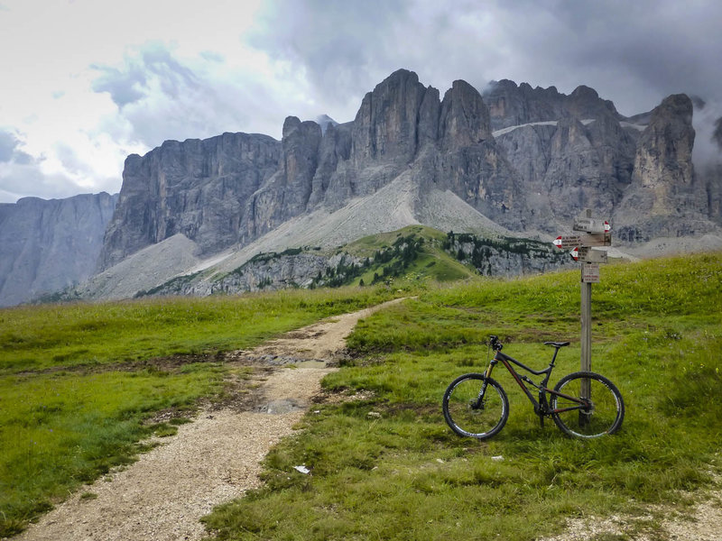 Near the start of the Sellaronda at the top of the Dantercepies lift looking at the Piz Boe with a trail marker typical of the region.