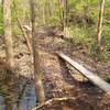 Log skinny across the spillway.