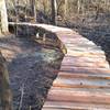 Elevated trail over low land that floods in the spring time.