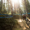 A young racer rounds a dusty turn on Jackass during the NW Cup, Silver Mountain Bike Park.