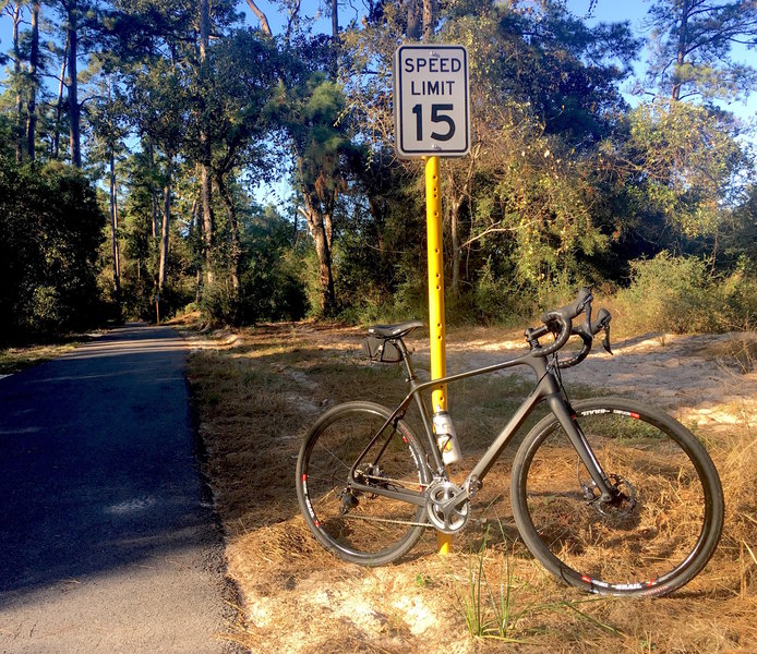 Some dirt trails alongside the paved path are open to MTB.