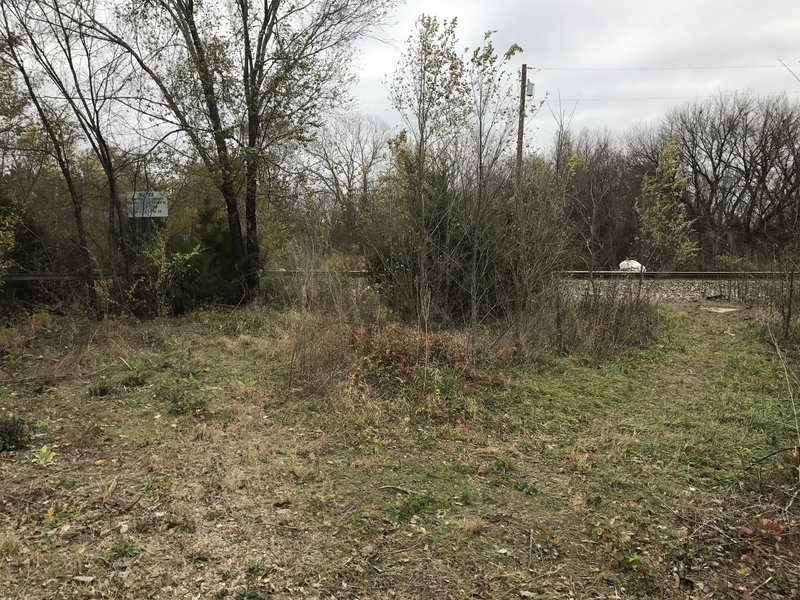 Signs on both sides of the tracks say Private Property.  Looks like people are still crossing here, but consider crossing at Lakin Street to the south.