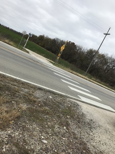 This is a signalized crossing with caution flashers for bikes and horse riders.