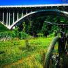 The smooth, grassy singletrack of the Mill Race to Rockhaven Connector offers great views of the Route 40 Bridge.