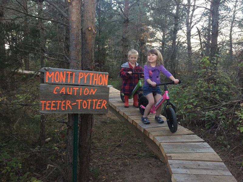 My little ones out on the trail helping me put up a new sign on the 100 ft Monti-Python!