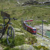 Singletrack paralleling the Bernina Express tracks through the Bernina Pass above Lago Bianco.  On the return trip, try to beat the train back to Samedan from the top of the pass starting from Ospizio Bernina station.