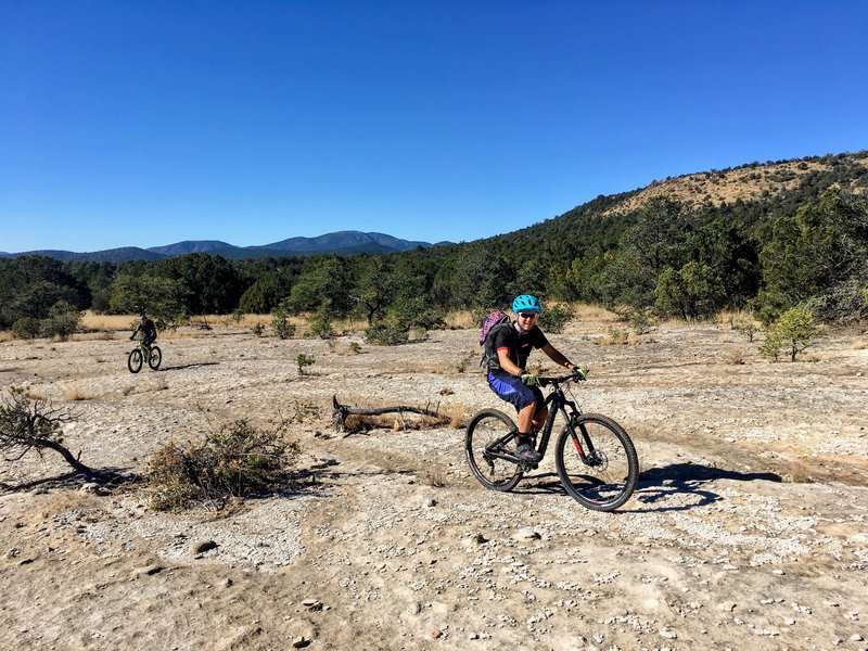 Riding out onto a large and scenic section of open, white slickrock that resembles the surface of the moon!