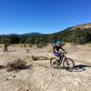 Riding out onto a large and scenic section of open, white slickrock that resembles the surface of the moon!