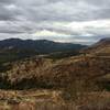 Looking west as the road winds its way through the mountains. The Chiricahua can be seen way off in the distance.