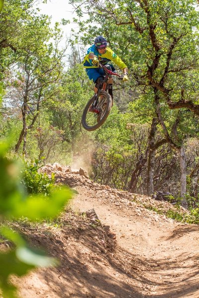 A rider gets rad on the jump on French Fry Trail.