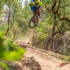 A rider gets rad on the jump on French Fry Trail.