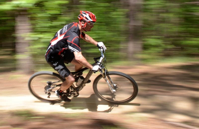 "Dust N Bones" is Mount Zion's annual race which is part of the MORCS series. This racer is enjoying the flowing downhill section near the beginning of the trail.