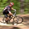 "Dust N Bones" is Mount Zion's annual race which is part of the MORCS series. This racer is enjoying the flowing downhill section near the beginning of the trail.