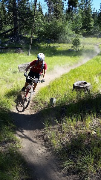 Dusty "S" turn on the Rim Trail Loop.