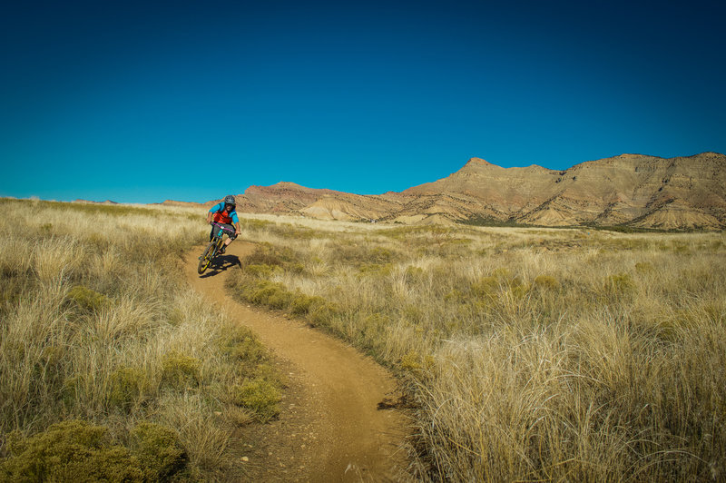 Flow for beginners but still fun for more advanced riders. If you want someone to learn to love mountain biking, Kessel Run is your trail!