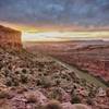 The sun sets along the edge of the Porcupine Rim Trail.