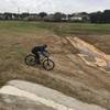 A rider hits a quick downhill through one of the drainages.