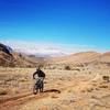 Golden grass, blue skies, sunshine, snow-covered mountains, and tacky trails equal a very happy rider!!