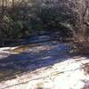 Mary Steele Falls trickles down the rocks trailside.