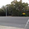 The entrance to Cullen Park Bike and Hike Trail is on the west side of SH 6, as viewed from the parking lot on the northeast corner of the intersection with Patterson Road.