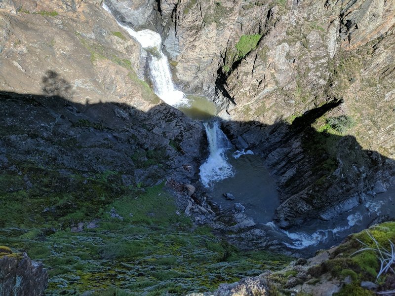 Watch your footing near this view down the cliff toward a few of the pools at Pacheco Creek Falls.