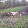 A debris pile offers passage over the wet ditch bottom at the junction of A Trail and D Trail.