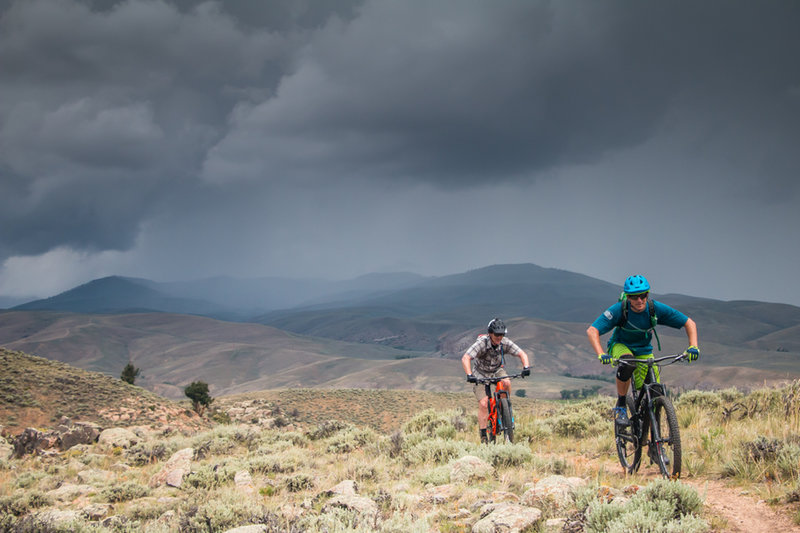 Our group outruns a storm at Hartman Rocks on Graceland, with the Crested Butte Valley in the distance.