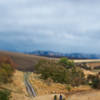 A pair of riders tackles a wet, cold, autumn ride on the Whitetail Trail near Bennington Lake.