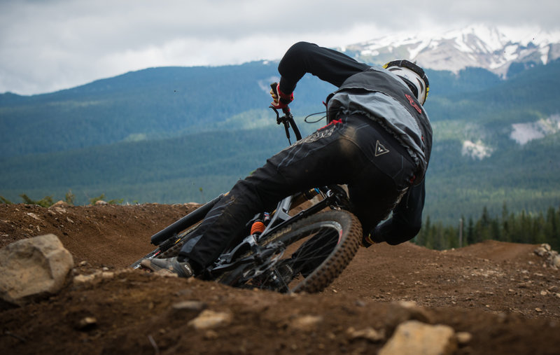 A racer rides fast and low through the berms on Cannonball.