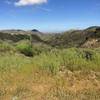 Relish in the clear view of the Santa Rosa Valley just before a sweet downhill.