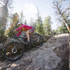 Lisa rides down the first rocky section on Lair O' the Bear.