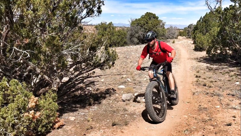 A rider makes his way across the top of the mesa.