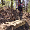 J. negotiates a skinny on the descent on Bushwhack's northern section.