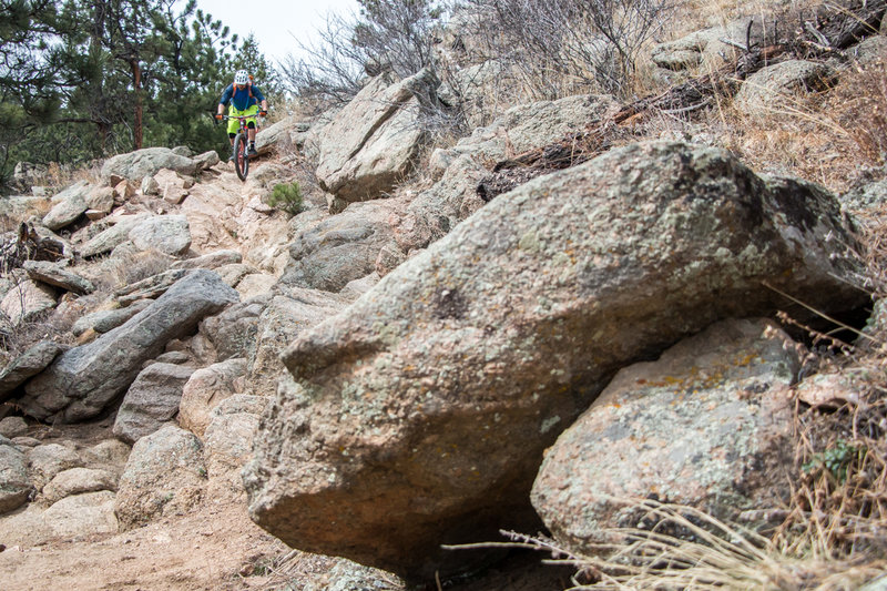 A rider takes the hard line before dropping down the stairs to Boulder Creek.