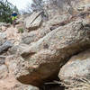 A rider takes the hard line before dropping down the stairs to Boulder Creek.