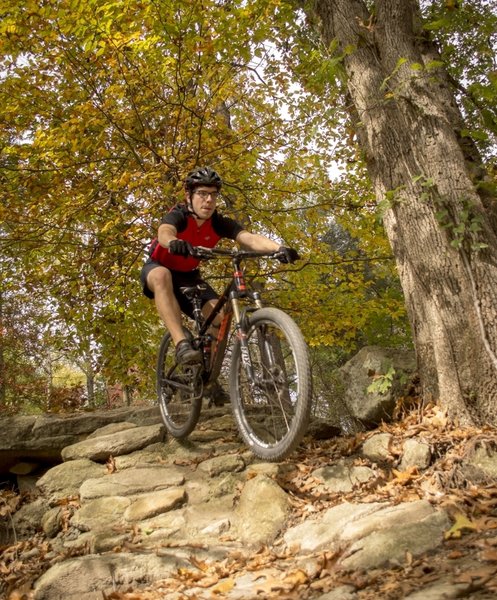 Concentration is needed hurtling down the rock feature toward the end of the trail.