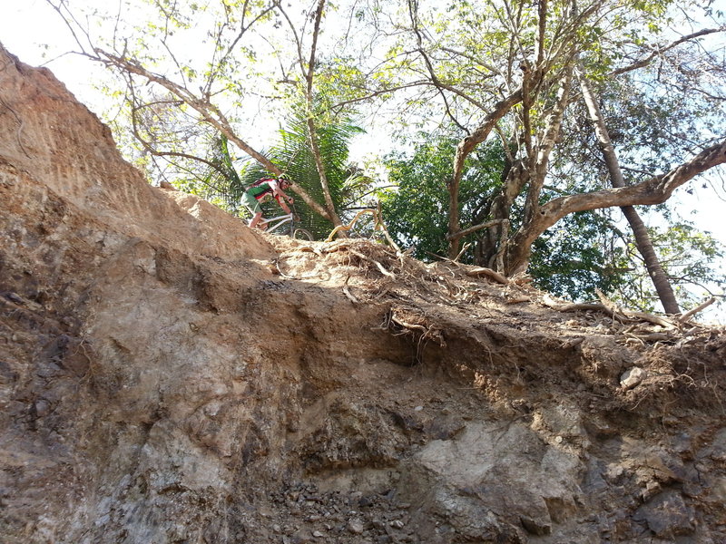 Javi riding near the edge on the Red Earth.