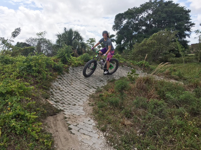 Julia rounds a paver-stone berm on the Potato Patch Trail, Quiet Waters Park MTB Trails.