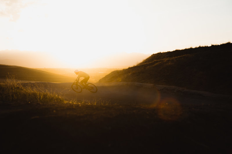 Nick hits one of the large berms on the "Black Line" on the Sunset Trails in Erie, CO