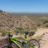 Looking east from the Mesquite Trail, just after the second switchback. The left side shows the first switchback near the bench.