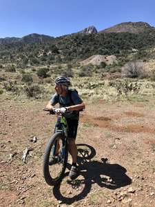Taking a break near some of the old mine ruins with Cookes Peak dominating the background.