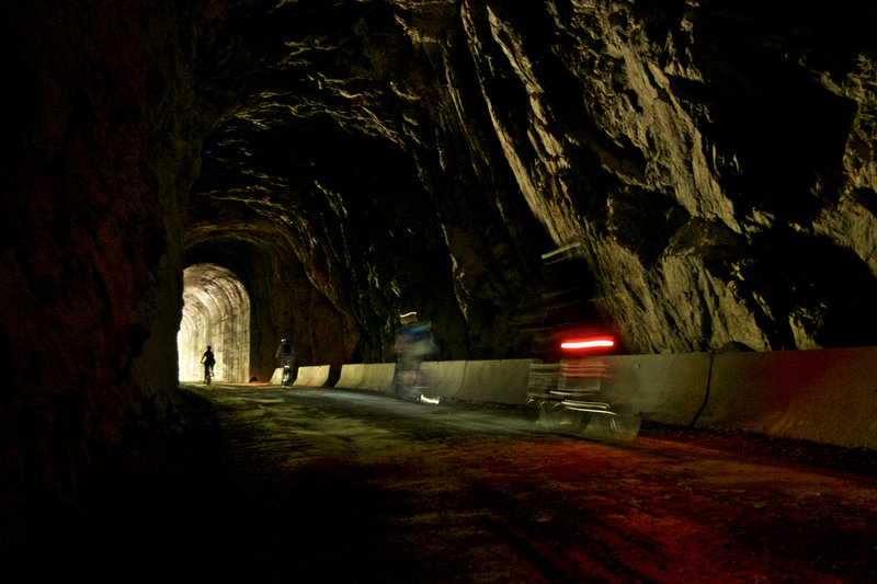 A bike light is mandatory for all the dark tunnels along the way.