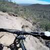 climbing up the east side during a counter-clockwise run on the Pass Mountain Trail. Ride clockwise for a better descent.