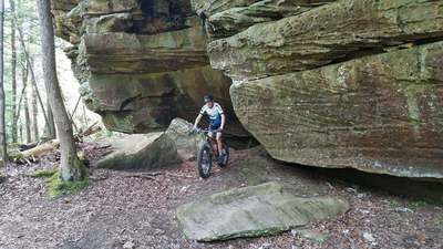 The trail winds in and out of many towering rocks as it follows the creek.