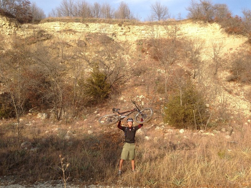 Celebrating a great ride and a cool bluff along the trail.